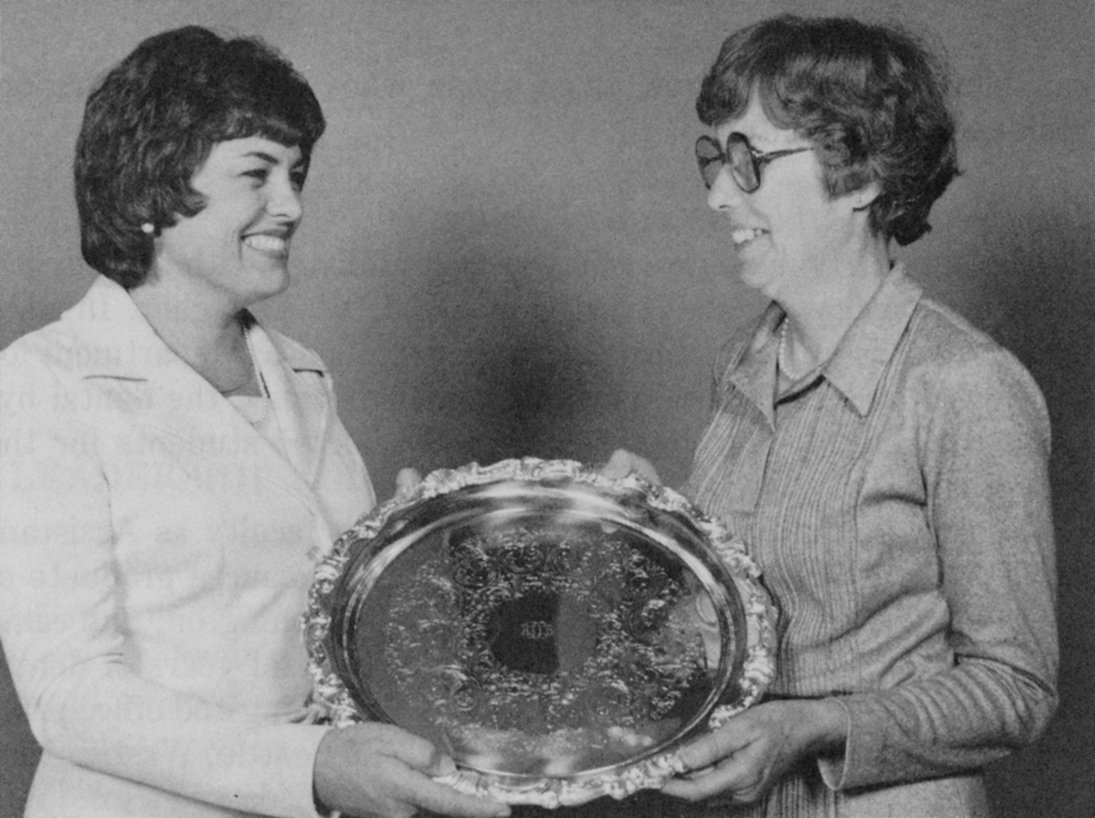Alberta receiving a silver tray in recognition of service